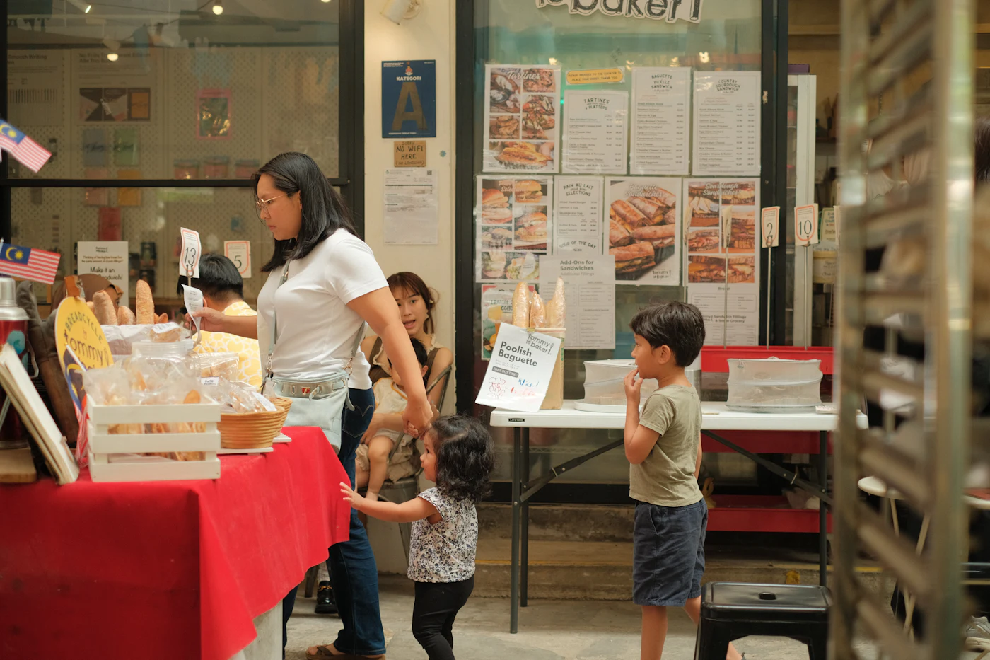 People choosing food at a bakery